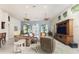 Inviting living room with comfortable seating, large windows, and stylish decor, perfect for relaxing and entertaining at 3507 Marsala Ct, Punta Gorda, FL 33950