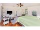 Bright primary bedroom with a large bed, cozy sitting area, and built-in storage at 3507 Marsala Ct, Punta Gorda, FL 33950