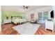Serene primary bedroom with vaulted ceilings, wood floors, and a comfortable sitting area at 3507 Marsala Ct, Punta Gorda, FL 33950