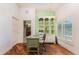 Dedicated home office space with a built-in bookcase, desk, and natural light from the window at 3507 Marsala Ct, Punta Gorda, FL 33950