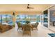 Spacious patio with seating area overlooking the pool and lush landscaping at 3507 Marsala Ct, Punta Gorda, FL 33950