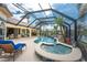 Beautiful backyard pool and spa with a covered patio and waterfront view at 3507 Marsala Ct, Punta Gorda, FL 33950