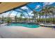 Enclosed pool area with tropical landscaping offering privacy and a resort-like experience at 3507 Marsala Ct, Punta Gorda, FL 33950