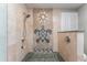 Pebble tiled shower with decorative turtle art at 3507 Marsala Ct, Punta Gorda, FL 33950