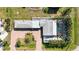Single-story home with pool and tropical landscaping, seen from above at 351 S Mccall Rd, Englewood, FL 34223
