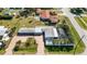 Aerial view of a single Gathering home with pool and large yard at 351 S Mccall Rd, Englewood, FL 34223
