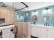 Updated bathroom features double vanity, large mirror, and a separate shower at 351 S Mccall Rd, Englewood, FL 34223