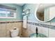 Updated bathroom with glass sink, shower, and tile flooring at 351 S Mccall Rd, Englewood, FL 34223