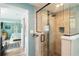 Spa-like bathroom with walk-in shower and pebble floor at 351 S Mccall Rd, Englewood, FL 34223