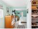 Bright bedroom with wood dresser, spacious closet, and light and airy decor at 351 S Mccall Rd, Englewood, FL 34223