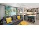 Comfortable living room with gray sofa, and open to the kitchen area at 351 S Mccall Rd, Englewood, FL 34223