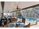 Covered patio with pool access and outdoor dining area at 351 S Mccall Rd, Englewood, FL 34223