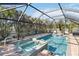 Relaxing screened-in pool and spa area with plenty of room for lounging at 351 S Mccall Rd, Englewood, FL 34223