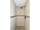 Large walk-in shower with hexagon tile floor at 351 S Mccall Rd, Englewood, FL 34223