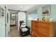 Relaxing sitting area with a barn door and built-in dresser at 351 S Mccall Rd, Englewood, FL 34223