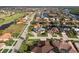 Aerial view of a luxury home community with waterfront properties and lush landscaping at 3800 Carupano Ct, Punta Gorda, FL 33950