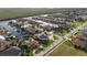 Aerial view of waterfront homes and lush landscaping in a residential neighborhood at 3800 Carupano Ct, Punta Gorda, FL 33950