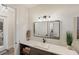 Modern bathroom with quartz countertop, sink, and large mirror at 3800 Carupano Ct, Punta Gorda, FL 33950