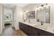 Double vanity bathroom with dark brown cabinets at 3800 Carupano Ct, Punta Gorda, FL 33950