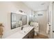 Spa-like bathroom with walk-in shower, quartz vanity, and patterned tile at 3800 Carupano Ct, Punta Gorda, FL 33950