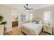 Charming bedroom with white bedding and en-suite bath at 3800 Carupano Ct, Punta Gorda, FL 33950
