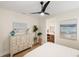 Bright bedroom with en-suite bathroom and coastal decor at 3800 Carupano Ct, Punta Gorda, FL 33950