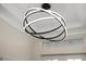 Modern circular chandelier adds a touch of elegance to the entryway at 3800 Carupano Ct, Punta Gorda, FL 33950