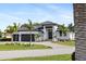 Stunning curb appeal! This modern home boasts a two-car garage and lush landscaping at 3800 Carupano Ct, Punta Gorda, FL 33950