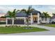 Stunning curb appeal! This home features a modern design, 2-car garage, and lush landscaping at 3800 Carupano Ct, Punta Gorda, FL 33950