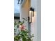 Contemporary exterior light fixtures add to the home's modern aesthetic at 3800 Carupano Ct, Punta Gorda, FL 33950