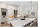 Modern kitchen with white shaker cabinets and large island at 3800 Carupano Ct, Punta Gorda, FL 33950
