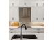 Sleek kitchen with black sink, faucet, and modern range at 3800 Carupano Ct, Punta Gorda, FL 33950
