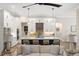 Modern kitchen with white cabinets, large island, and stainless steel appliances at 3800 Carupano Ct, Punta Gorda, FL 33950