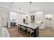 Spacious kitchen with white cabinets, quartz countertops, and island seating at 3800 Carupano Ct, Punta Gorda, FL 33950