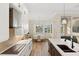 Modern kitchen with white cabinets, breakfast nook, and island at 3800 Carupano Ct, Punta Gorda, FL 33950