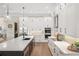 Eat-in kitchen with white cabinetry and expansive island at 3800 Carupano Ct, Punta Gorda, FL 33950