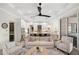Open concept living room and kitchen with island at 3800 Carupano Ct, Punta Gorda, FL 33950