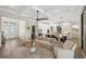 Open-concept living area with hardwood floors, neutral color palette, and ample natural light at 3800 Carupano Ct, Punta Gorda, FL 33950