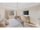 Main bedroom with large TV and ample closet space at 3800 Carupano Ct, Punta Gorda, FL 33950