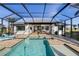 Resort-style pool with covered lanai and outdoor kitchen; ideal for entertaining at 3800 Carupano Ct, Punta Gorda, FL 33950