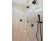 Walk-in shower with pebble tile floor and dual shower heads at 3800 Carupano Ct, Punta Gorda, FL 33950
