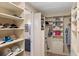 Spacious walk-in closet with custom shelving and a safe at 3800 Carupano Ct, Punta Gorda, FL 33950