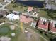 Aerial view of condo building near golf course and pool at 3919 San Rocco Dr # 31A, Punta Gorda, FL 33950