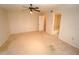 Spacious bedroom with ceiling fan and en-suite bathroom at 3919 San Rocco Dr # 31A, Punta Gorda, FL 33950