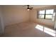 Spacious bedroom with large window and ceiling fan at 3919 San Rocco Dr # 31A, Punta Gorda, FL 33950