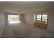 Living room with golf course view and access to balcony at 3919 San Rocco Dr # 31A, Punta Gorda, FL 33950