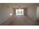 Living room with access to balcony and golf course view at 3919 San Rocco Dr # 31A, Punta Gorda, FL 33950