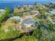 Aerial view of a waterfront property with boat access and lush greenery at 425 Fireball Ct, Punta Gorda, FL 33950
