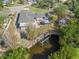 Aerial view of a cozy single-Gathering home featuring a private dock with access to the tranquil waters, close to nature at 425 Fireball Ct, Punta Gorda, FL 33950