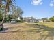 Expansive backyard featuring a gazebo, mature trees and green space at 425 Fireball Ct, Punta Gorda, FL 33950